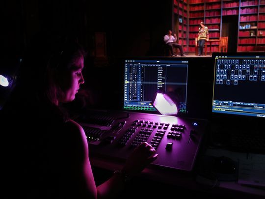 In this file photo, general technician intern Megan Navia works the lighting board during the Gulfshore Playhouse's tech rehearsal of the play "The Who and the What?" at the Norris Community Center in Naples in April 2016. Gulfshore Playhouse plans to build a state-of-the-art theater and education complex in downtown Naples.